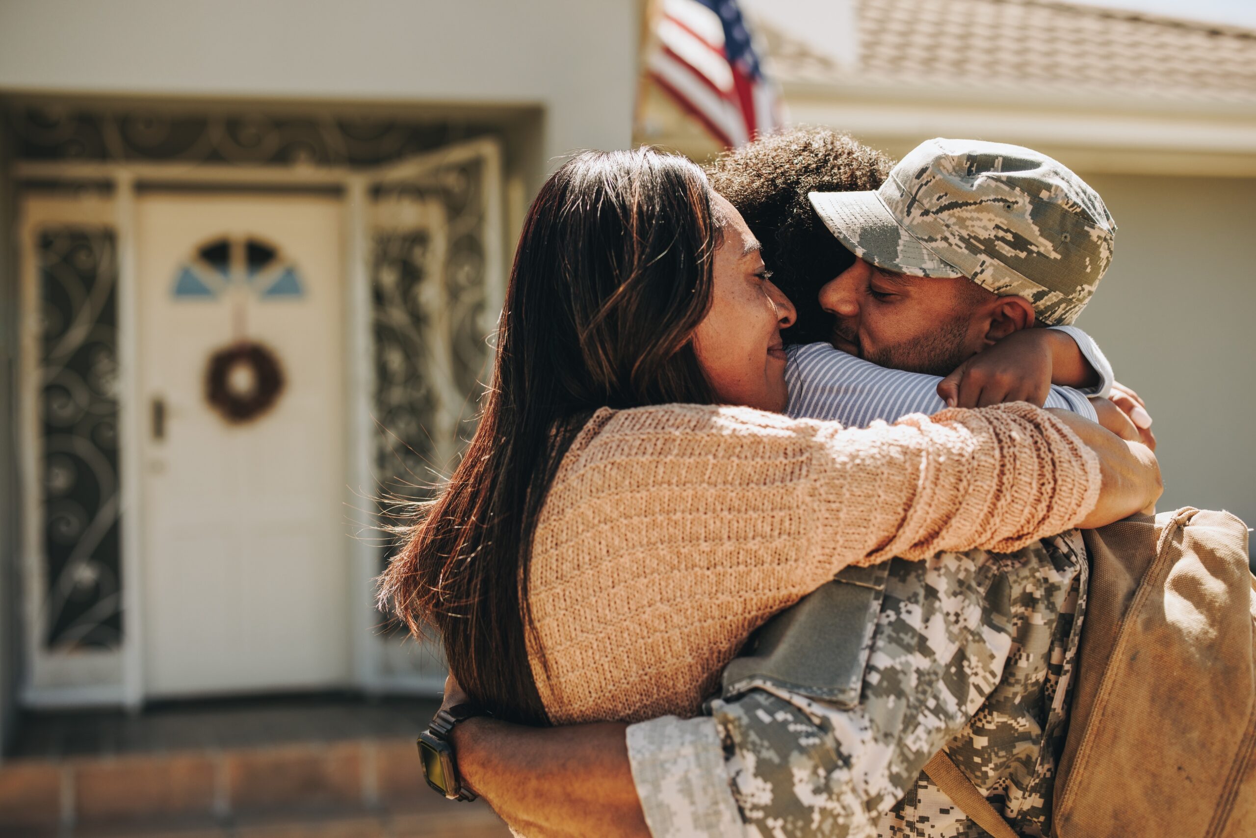 Family hugging veteran after pursuing his va rating for depression and anxiety